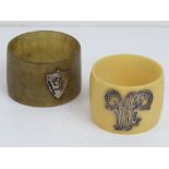 Two napkin rings; one horn napkin ring with HM silver shield shaped cabachon bearing the letter D,