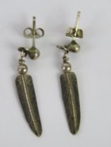 A pair of Native American feather pattern earrings, no apparent marks, 3.3cm in length.