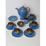A Crown Devon Fieldings turquoise and copper coloured coffee service comprising five cups and