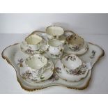 A 19thC tea set comprising three cups, four saucers, jug, sugar bowl and tray,