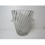 A large cut glass champagne ice bucket having twin handles.