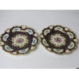 A pair of Royal Worcester cabinet plates of floral pattern upon white and cobalt blue ground with