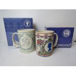 Two large boxed commemorative mugs by Wedgwood.