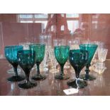 A pair of emerald green coloured glasses together with four assorted emerald green glasses.