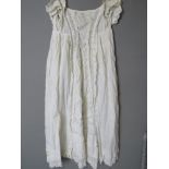 A white cotton and lace Christening robe.