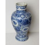 An Oriental blue and white vase, a/f, having been naively restored.