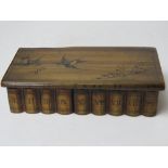 A handmade puzzle type box having hidden front slide release for lid decorated with swallows upon,