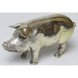 A HM silver figurine of a pig (filled), hallmarked for London 1994, 9cm in length.