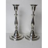 A pair of HM silver tall candlesticks,