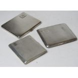 Three HM silver cigarette cases,