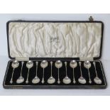 A set of twelve teaspoons in original fitted box hallmarked for Birmingham 1928, weighing 157.