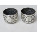 A pair of HM silver salts having repoussé design throughout and hallmarked London 1896, 79.3g / 2.