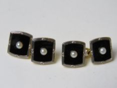 A pair of 18ct gold platinum onyx and seed pearl cufflinks, stamped 18ct & Pt 7g.