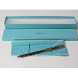 A Tiffiny & Co HM silver letter opener having London Import hallmark and complete with box, 33.9g.