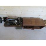 A vintage Singer sewing machine having cable accessories, lid, key, etc, serial no Y8004507.