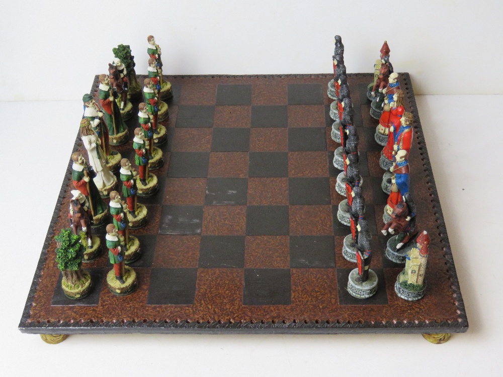 A contemporary medieval themed Chess set complete with board,