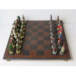 A contemporary medieval themed Chess set complete with board,