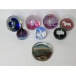 Five Caithness glass paperweights being