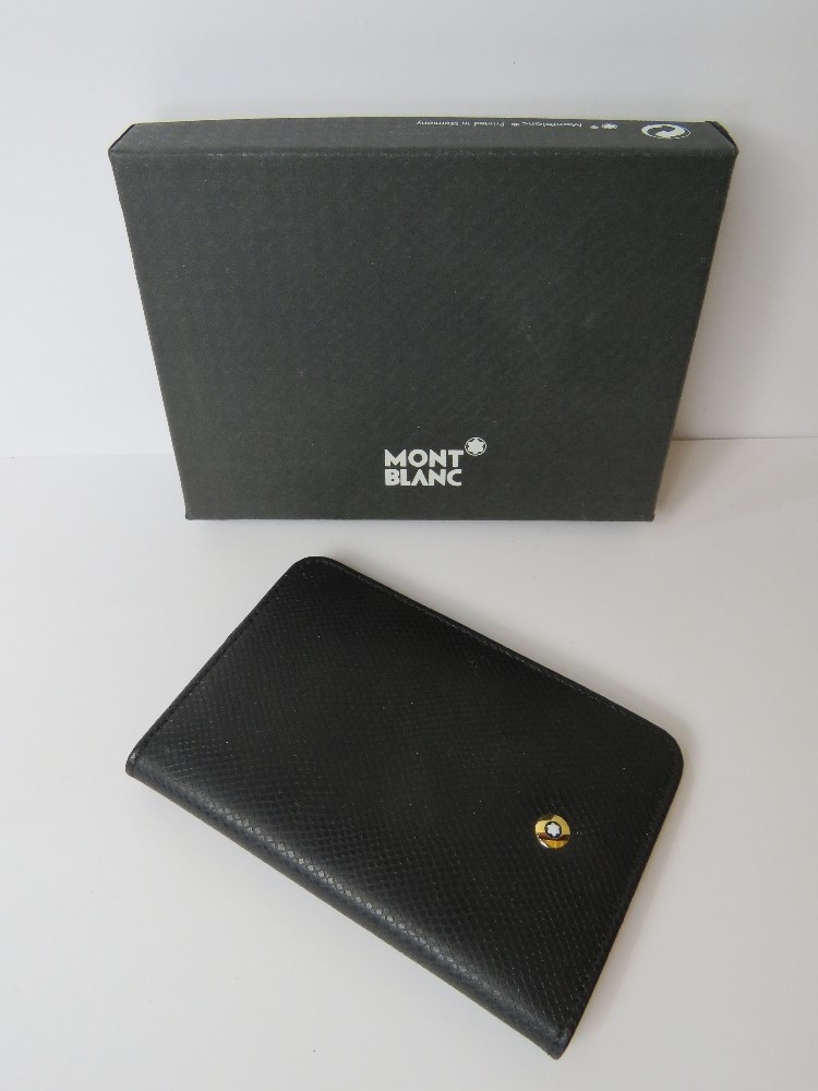 A Mont Blanc leather card wallet in black with red interior, in original box.