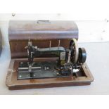 A vintage sewing machine in case Frister & Rossmann Berlin. Inlaid with Mother of Pearl.
