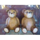 A pair of carved wooden Teddy bear figurines for use as bookends, 18cm high.