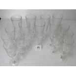 A set of seven champagne flutes together