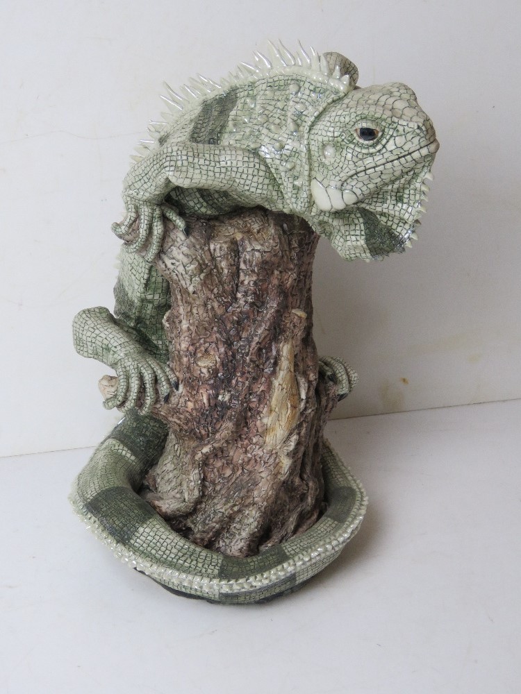 A Jill Moger sculpture of a lizard on naturalistic base. Nbr 3/95. Approx 32cm high.