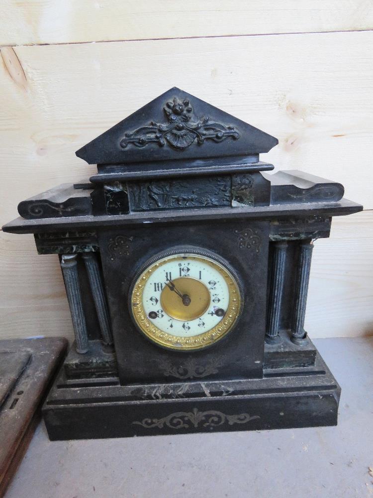 A Victorian black slate architectural mantle clock, for restoration, approx 35cm wide.