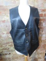 A 100% black leather waistcoat size XL.