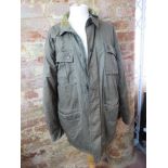 A 100% cotton coat having corduroy colla