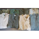 Eight assorted men's shirts in shades of