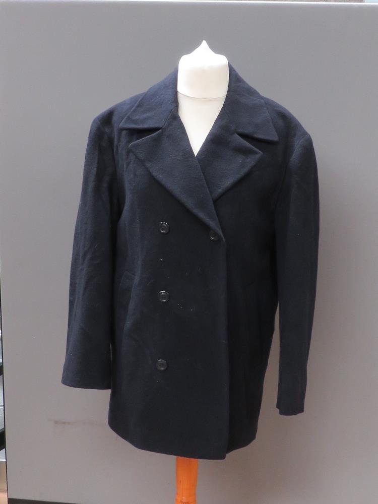 A navy blue belted woollen coat by Deben