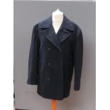 A navy blue belted woollen coat by Deben