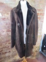 A brown leather mouton (sheepskin) coat