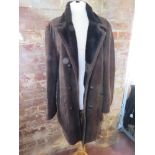 A brown leather mouton (sheepskin) coat