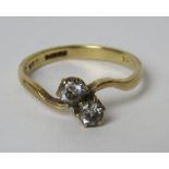 A 9ct gold ring set with two white stones, size O, 2.2g.