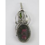 A handmade filigree floral pendant having large purple stone, 5.5cm inc bale.