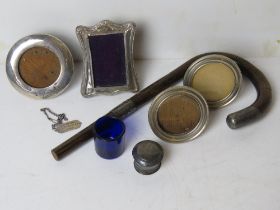A quantity of silver items including four small photograph frames a/f,