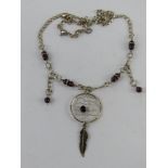 A silver necklace having Native American style dream catcher pendant upon, stamped 925.