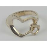 A silver ring in the form of two hearts, stamped 925, size M.