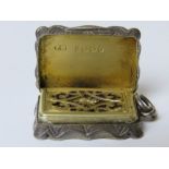 A Victorian silver vinaigrette with sponge, having gilt interior and hinged grill,