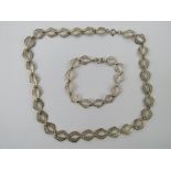 A silver filigree necklace and bracelet suite, each stamped 925, necklace 44.