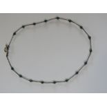 A Native American style green stone and silver beaded type necklace with T bar clasp,