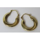 A pair of 9ct gold hoop earrings, stamped 375, 0.7g.