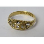 An 18ct gold diamond Gypsy ring having carved head and Chester hallmark, size M, 2.3g.