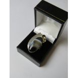 A large hardstone cocktail ring stamped 925, size O-P in presentation box.