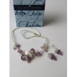 A contemporary beaded necklace and earring having floral and grape design in Oliver Weber