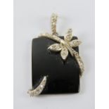 A silver and onyx pendant of rectangular form having butterfly design upon, stamped 925, 3.