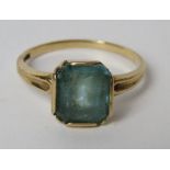 A 10ct gold Art Deco ring having central emerald cut blue stone, stone slightly a/f, size O-P, 2.8g.