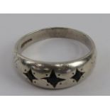 A HM silver three stone gypsy ring, hallmarked Birmingham, size O.